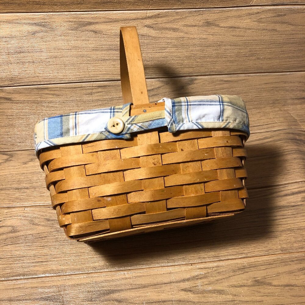 Longaberger woven lined basket, with single middle handle
